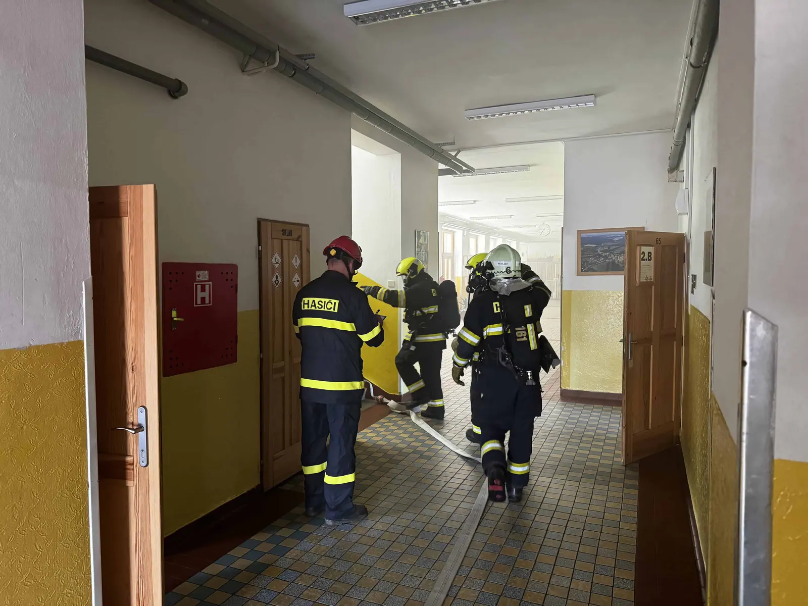 Firefighters in the school corridor